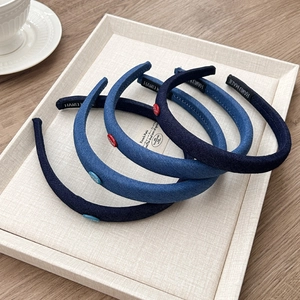 Set of four minimalist denim blue headbands with red button accents and handmade label