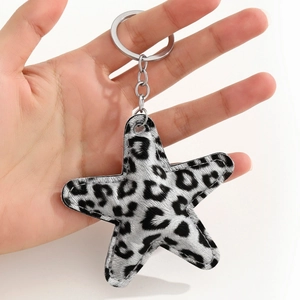 Leopard print star keychain made of premium faux leather with secure silver metal ring