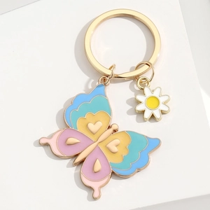 Porte-clés papillon en émail coloré et marguerite avec anneau en alliage doré