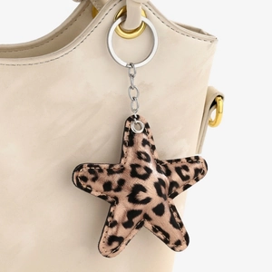Star-shaped faux leather leopard print charm with metallic keychain for handbags