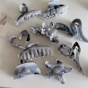 Lot de pinces à cheveux en acétate marbré gris aux formes cœur et étoile élégantes
