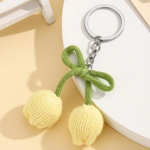 Handmade knitted tulip flower keychain with green bow and silver ring accessory