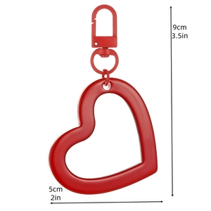 Red heart-shaped keychain pendant charm with dimensions 9cm by 5cm on white background