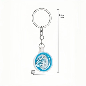 Luminous miniature coffee cup keychain with artistic blue latte art and metal ring