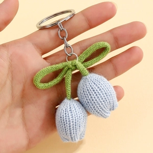 Handmade knitted blue tulip flower keychain with silver ring and green leaves pendant