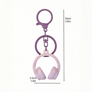 Purple 3D headphone keychain pendant with product dimensions 10cm by 3.5cm