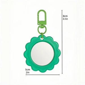 Portable green sunflower shaped pocket mirror keychain with dimensions of 8cm by 5cm