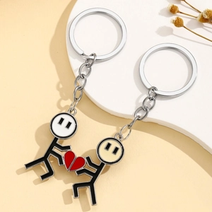 Matching stickman couple keychains with interlocking red heart pendants for lovers