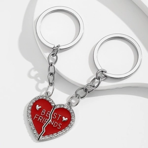 Detailed close-up of red enamel heart-shaped Best Friends keychain with rhinestones