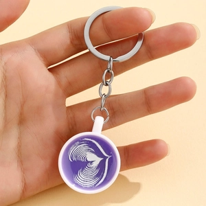 Creative glowing coffee cup keychain with purple latte art and silver metal ring