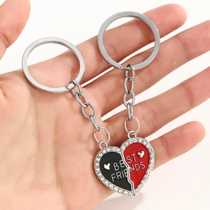 Close-up of split heart Best Friends keychains with red and black enamel and crystals