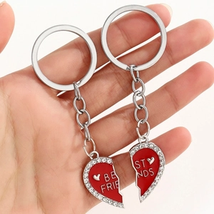 Close-up of heart-shaped Best Friends keychains with red enamel and sparkling rhinestones