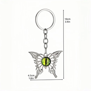 Gothic butterfly evil eye keychain with silver metal wings and green eyeball pendant