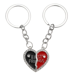 Matching heart-shaped Best Friends keychains with red and black enamel and sparkling rhinestones