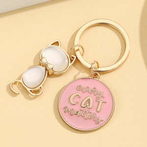 Cute alloy cat keychain with white opals and pink every CAT matters charm on gold chain