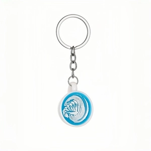 Luminous miniature coffee cup keychain with blue latte art and white resin cup detail