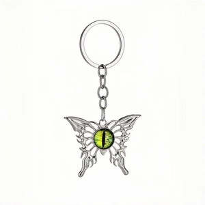 Gothic butterfly keychain with evil eye glass pendant and silver flame hollow wings