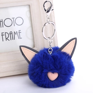 Detail of blue plush cat ear keychain with heart detail and silver lobster clasp