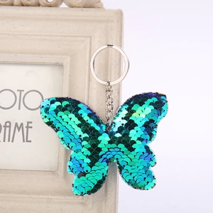 Sparkly sequin butterfly keychain with blue-green gradient finish for bag accessories