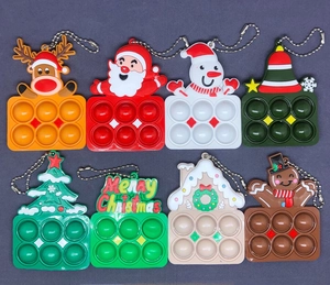 Set di 8 portachiavi pop-it natalizi in silicone con Babbo Natale e renna colorati