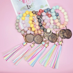 Bracciali con perle leopardate e ciondolo MAMA in legno con nappe colorate idea regalo mamma