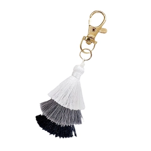Three-tier cotton tassel keychain in white grey and black with gold lobster clasp