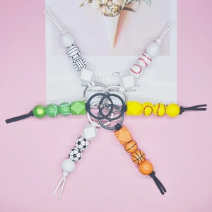 Set of 6 sports-themed beaded keychains with volleyball, baseball, and football beads