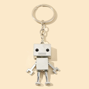 Movable alloy robot keychain in silver finish with black gemstone eyes and square body