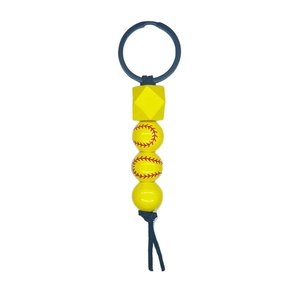 Sporty keychain featuring yellow beads and softball print beads with a black tassel