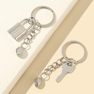 Magnetic heart couple keychain set featuring silver padlock and key metal pendants