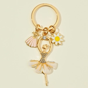 Detailed close-up of a golden ballerina keychain with rhinestones and floral charms