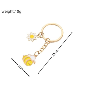 Détails du porte-clés marguerite et abeille avec mesures précises 7.5cm et poids 10g