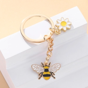 Porte-clés en métal doré avec abeille et marguerite, pendentifs émaillés pour sacs