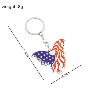 Detailed view of eagle car charm with American flag design and 9.5cm length dimensions