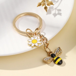 Porte-clés abeille dorée et marguerite avec cristaux brillants pour sacs à main