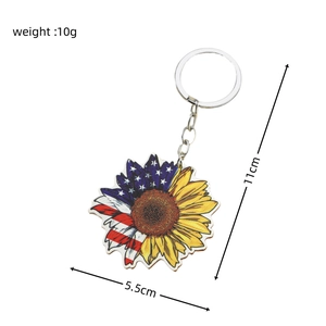 Sunflower keychain with American flag pattern detail and dimensions 5.5cm by 11cm