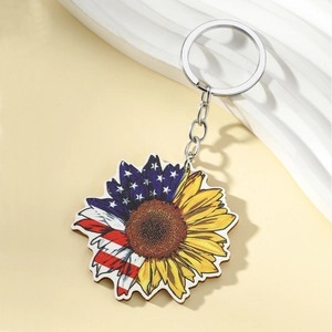 Detail of sunflower keychain featuring American flag petals and silver metal ring