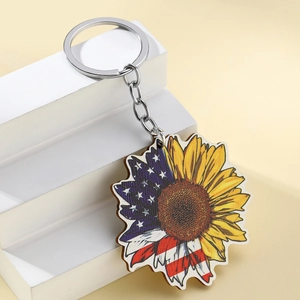 Detail view of sunflower wooden keychain with American flag motif and metal ring