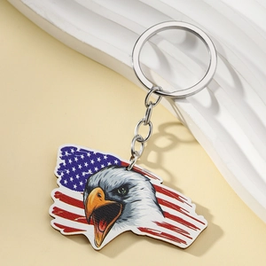 Detail of Montana state map keychain with bald eagle and American flag pattern