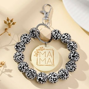 Leopard print beaded wristlet keychain with wooden MAMA pendant and metal lobster clasp