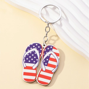Detailed view of flip-flop keychain with American flag design on modern background