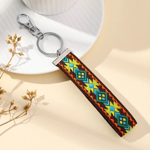 Ethnic embroidery keychain with colorful geometric patterns and silver clasp