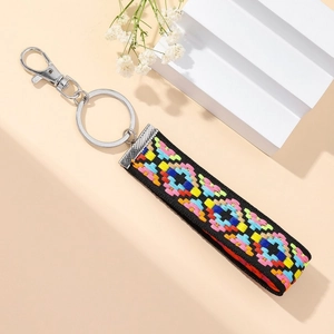 Ethnic style braided keychain with colorful geometric floral embroidery and silver ring
