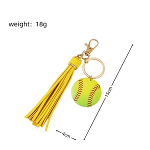 Close-up of yellow tassel softball keychain with dimensions showing 15cm length