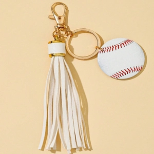 Mini baseball keychain with white PU tassel and golden lobster clasp on beige background
