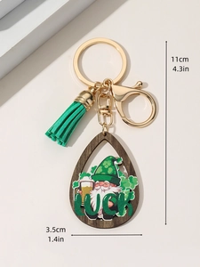 Detailed view of St. Patrick's Day gnome keychain with green tassel and luck charm