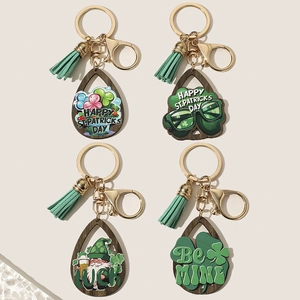 Saint Patrick's Day wooden clover keychains with green tassels and festive charms