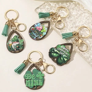 Saint Patrick's Day wooden shamrock keychains with green tassels and lucky charms