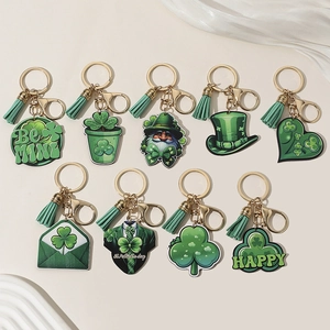 St. Patrick's Day green clover and heart keychain set with gold hooks on silk fabric