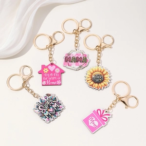Detailed set of acrylic Mother's Day keychains with pink and gold sunflower themes